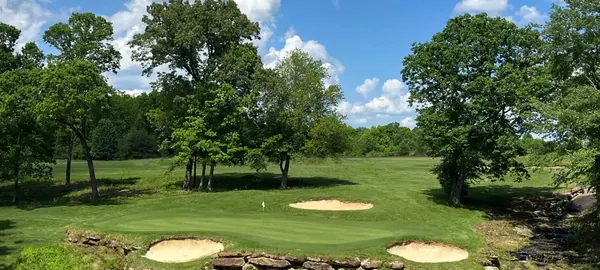 The seventh hole at Bear Trace at Cumberland Mountain, with sand bunkers and wooded fairways
