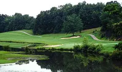 Archival River Run Golf Club green and fairway beside a pond