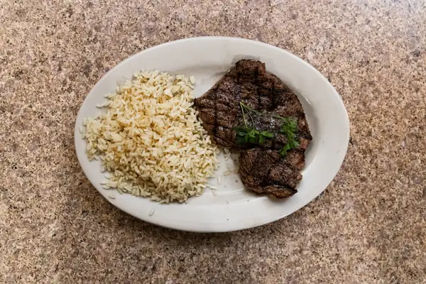 Steak and rice plate pictured in the Beef and Barrel Crossville tourism listing