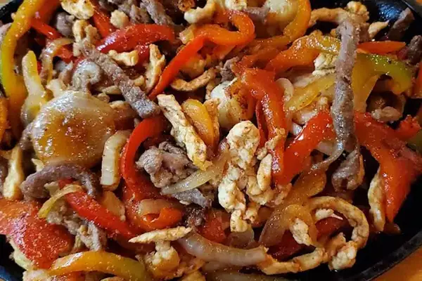 Fajitas with grilled meat, peppers, and onions from Casa Grande’s restaurant photo gallery