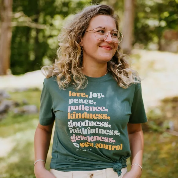 A model wearing a green faith-inspired Halo T-shirt
