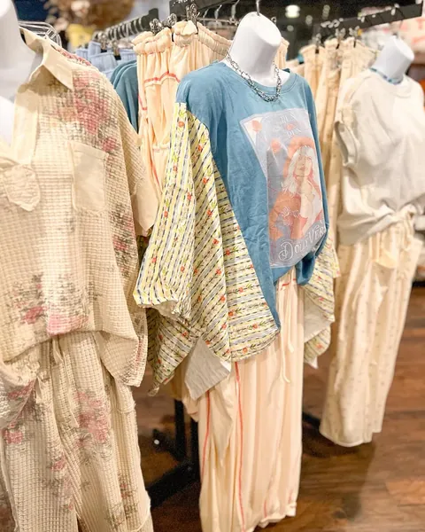 Clothing racks and coordinated outfits at Morning Sage Boutique