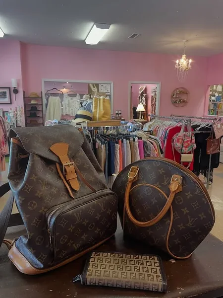 Handbags and clothing racks inside Pretty Clothes Shoppe in Crossville