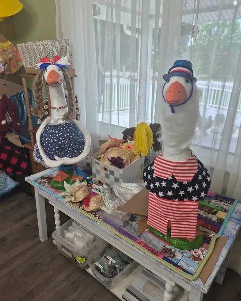 Decorative goose figures and seasonal gifts displayed at The Red Door Market