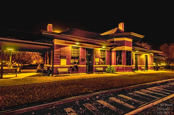 Cookeville Depot Museum illuminated at night beside the railroad tracks
