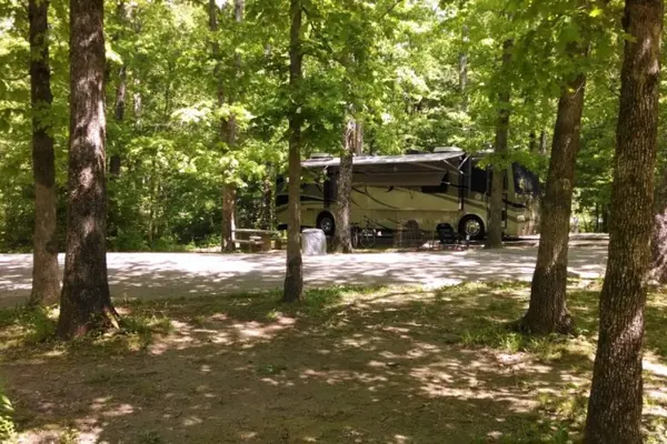 RV campsites among the trees at Cumberland Mountain State Park