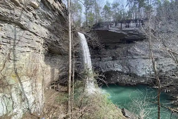 Ozone Falls plunging past sandstone cliffs into the pool below